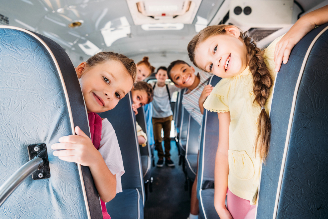 Stock image of schoolchildren on a bus, photo by DGT
